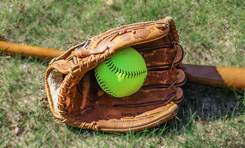 Softball glove on a field
